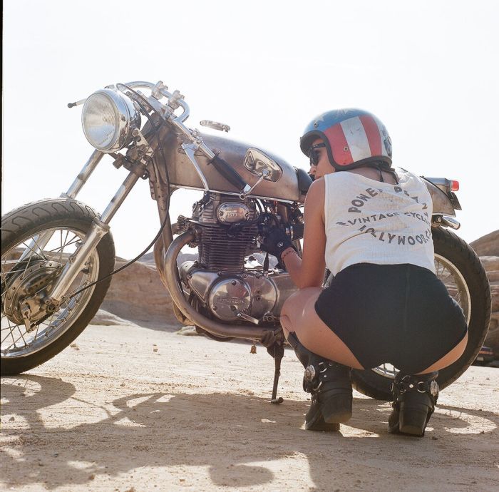 A playful frame from Girls on a motorcycle — online in Pune